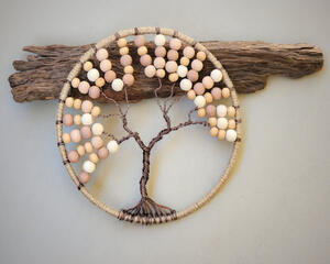 jute wrapped hoop with brown wire tree of life attached various tones of sand, cream, and beige color wood beads adorn branches